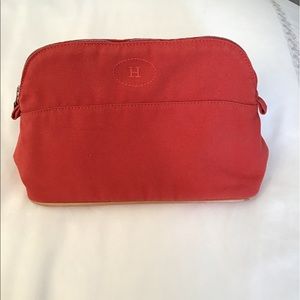 Red Hermès cosmetic bag
